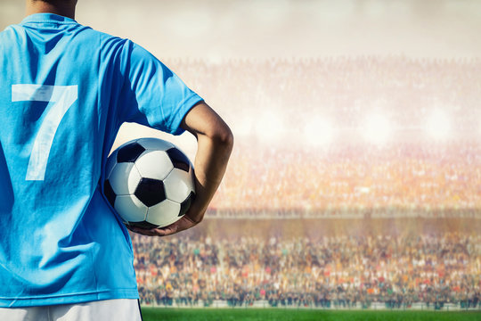 soccer football player in blue team concept holding soccer ball