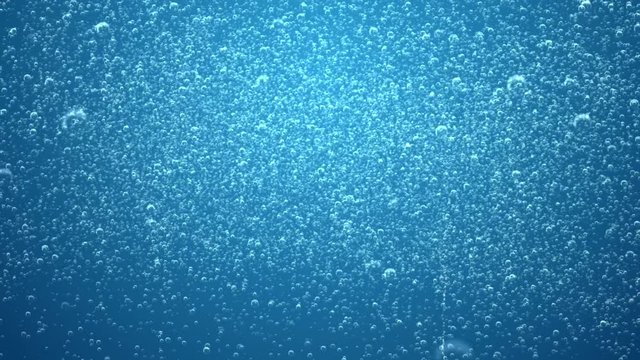 A blue background of extra soda bubble fizz with last 10 seconds loop at end.