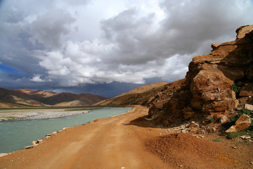 Fototapeta na wymiar Road along the river in Tibet