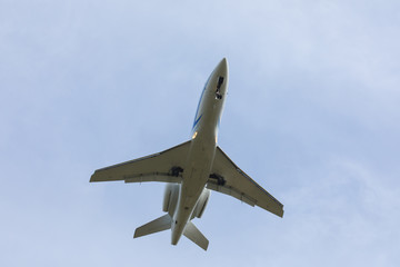 Bottom view airplane takeoff to the sky. the rise of the real aircraft in the sky.