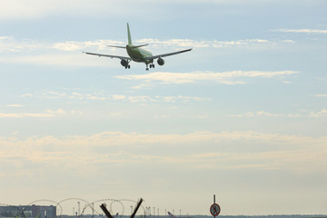 Bottom view airplane takeoff to the sky. the rise of the real aircraft in the sky.