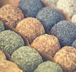 Colorful healthy homemade candies with nuts, dry fruits and spices