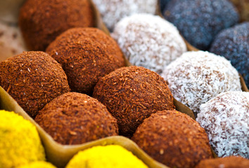 Colorful healthy homemade candies with nuts, dry fruits and spices
