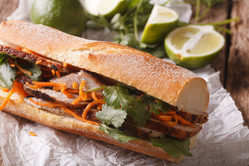 Vietnamese sandwich with cilantro and carrot close-up. horizontal