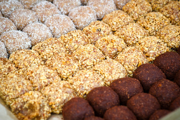 Colorful healthy homemade candies with nuts, dry fruits and spices