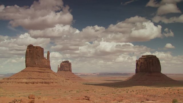 Rock formation in monument valley against cloudy sky