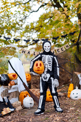 Obraz na płótnie Canvas Boy in a skeleton costume on Halloween