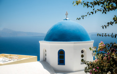 Fototapeta na wymiar Blue dome of orthodox church in Santorini