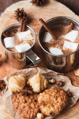 Metal mugs with cacao and marshmallow