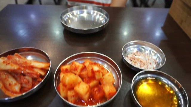Korean restaurant set up with stainless steel ware as popular traditional culture for cuisine