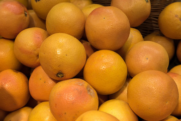 Group of fresh grapefruits at a fruit market