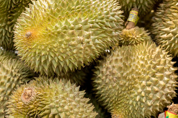 Naklejka na ściany i meble Group of thai durian at a fruit market