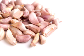 garlics pile on white background