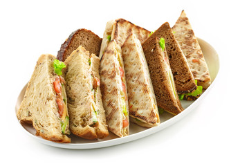 plate of various triangle sandwiches