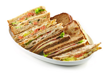 plate of various triangle sandwiches