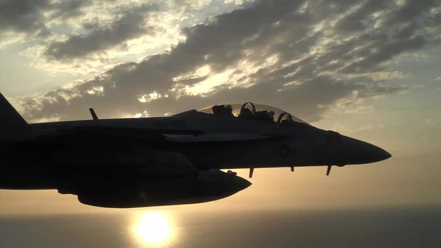 Fighter plane sunset, F/A-18 Super Hornet fighter jet during sunset.