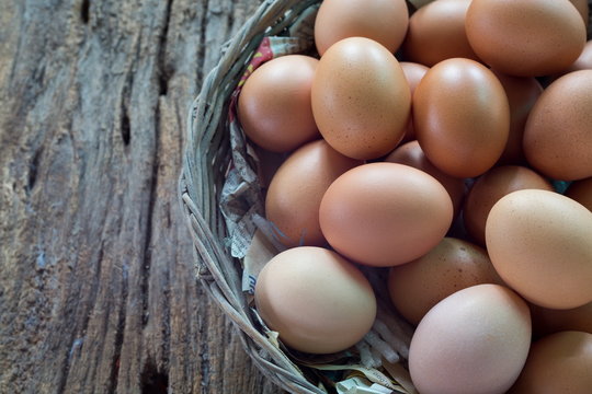 Egg in basket on natural wood,Fresh eggs.