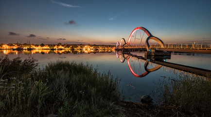 Solvesborg pedestrian bridge with city - night view