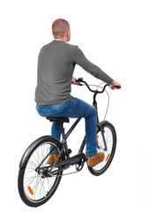 Naklejka premium back view of a man with a bicycle. cyclist rides a bicycle. Rear view people collection. backside view of person. Isolated over white background.