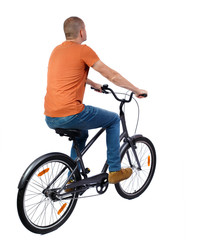 back view of a man with a bicycle. cyclist rides a bicycle. Rear view people collection.  backside view of person. Isolated over white background.