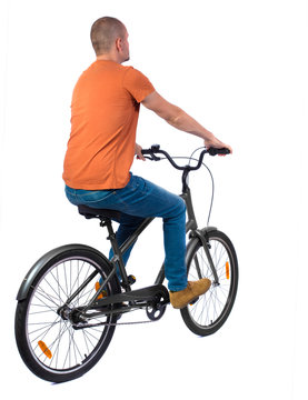 back view of a man with a bicycle. cyclist rides a bicycle. Rear view people collection.  backside view of person. Isolated over white background.