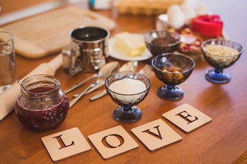 decoration of the plates with letters spelling love with kitchen units and grocery