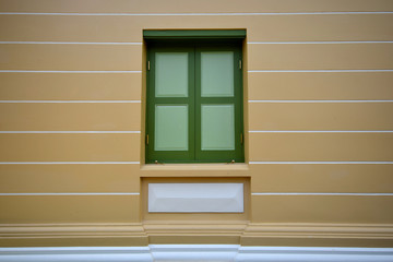 Old wall with wooden window