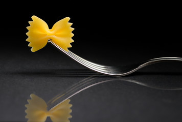 Pasta farfalle on a fork