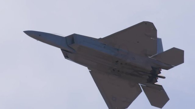 Tracking shot of fighter jet flying in the sky