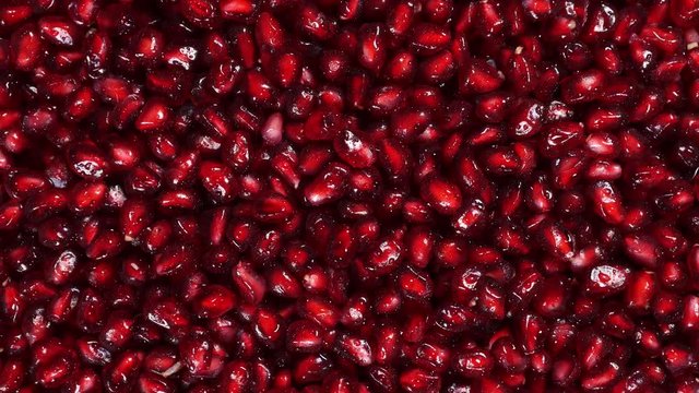 Rotating fresh pomegranate seeds for food