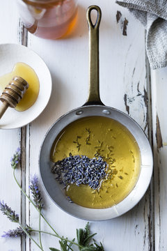 Honey and lavender buds in pan