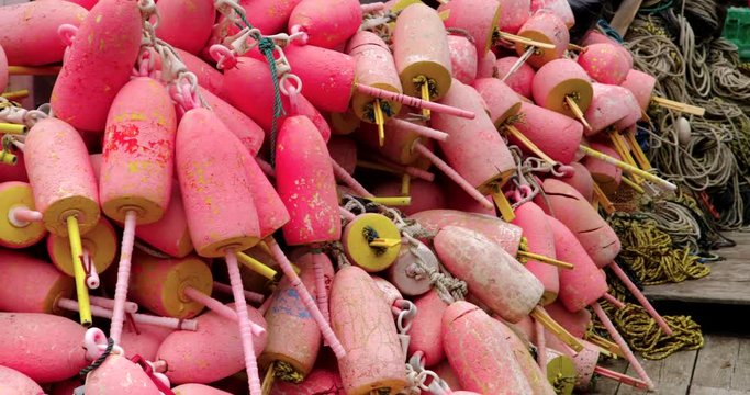 Close up pan of lobster trap buoys