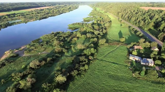 aerial landcape of river in green meadows