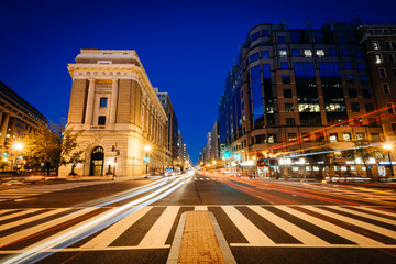 Buildings and traffic along H Street at night, in Washington, DC