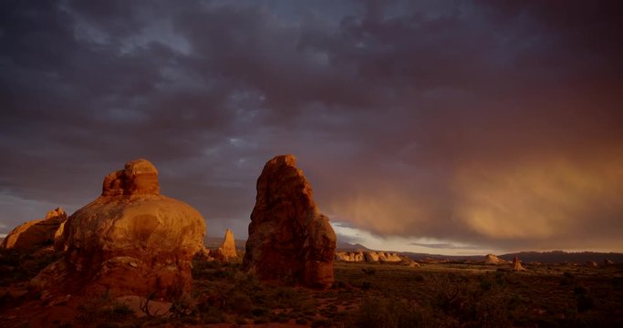 Wide pan of scenic rock formation in desert