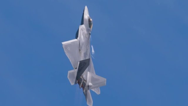Slow motion tracking of fighter jet flying in the sky