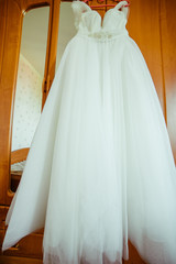Fototapeta na wymiar A look from below on the luxurious wedding dress
