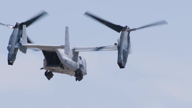 Slow motion of osprey helicopter flying in the sky