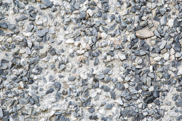 Many, small stones in the wall. Background.