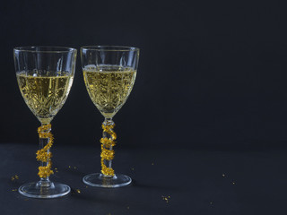 Christmas Decorated wine glasses with sparkling wine.