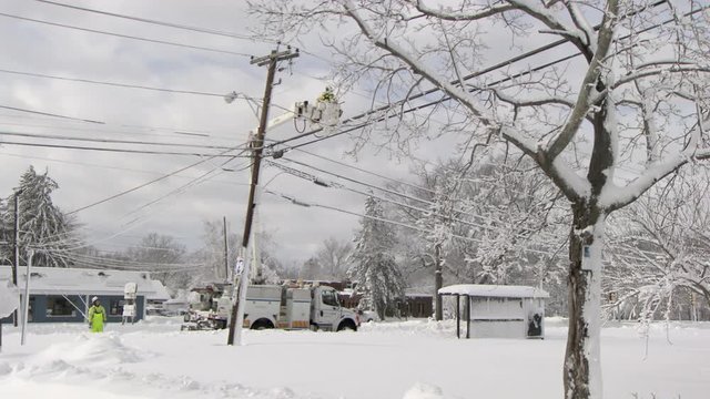 Workers repairing power lines after blizzard