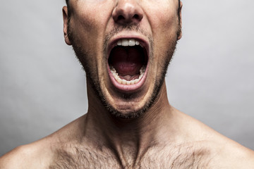 close up portrait of a man shouting, mouth wide open - Powered by Adobe
