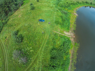 The view from the height of the river Mologa and the car next to