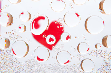 Heart behind water drops. Abstract background