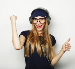 Happy young woman giving thumb up
