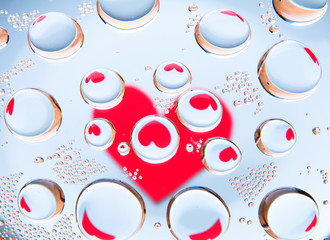 Heart behind water drops. Abstract background