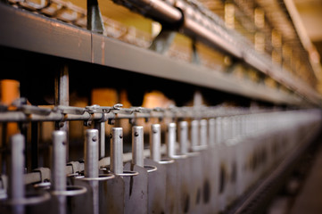 Perspective of a factory wool curl thread machine