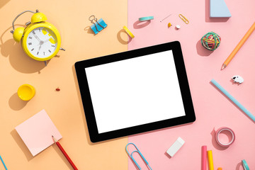 Creative office, student desk with tablet. Flat lay. View from above