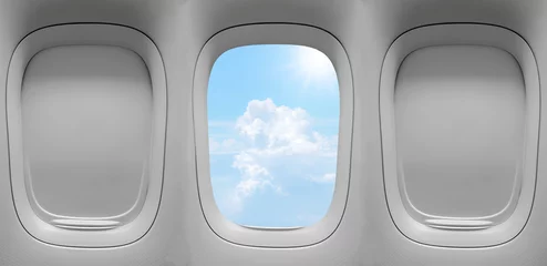 Fotobehang Closeup group of the airplane windows with the clouds sky background. © ETAP