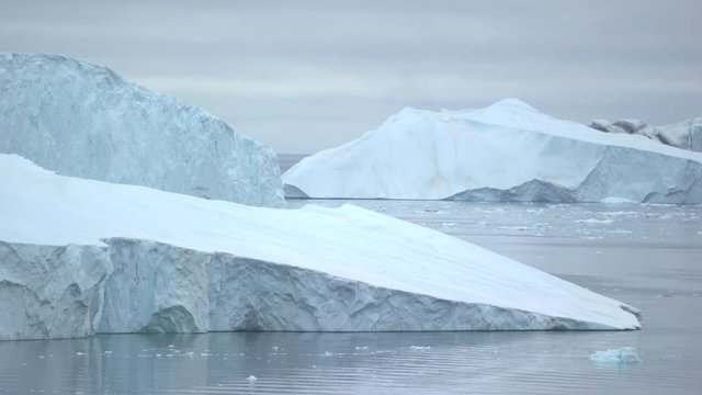 huge icebergs are on the arctic ocean